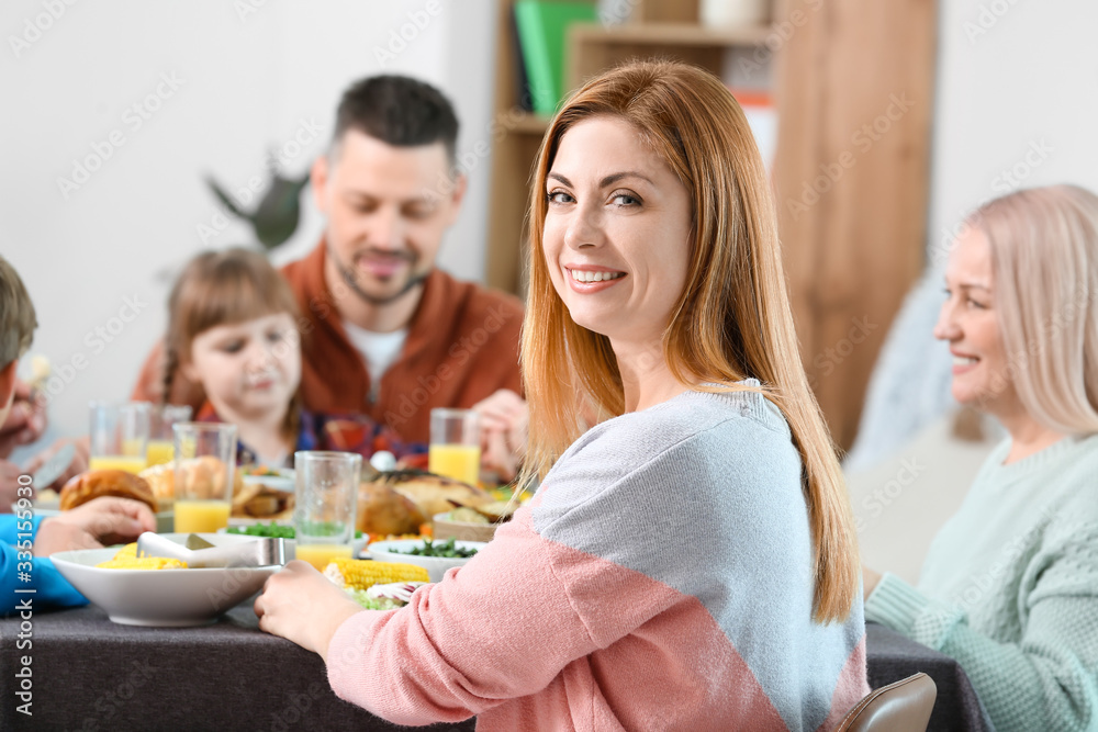 Woman with family celebrating Thanksgiving Day at home Woman with family celebrating Thanksgiving Day at home