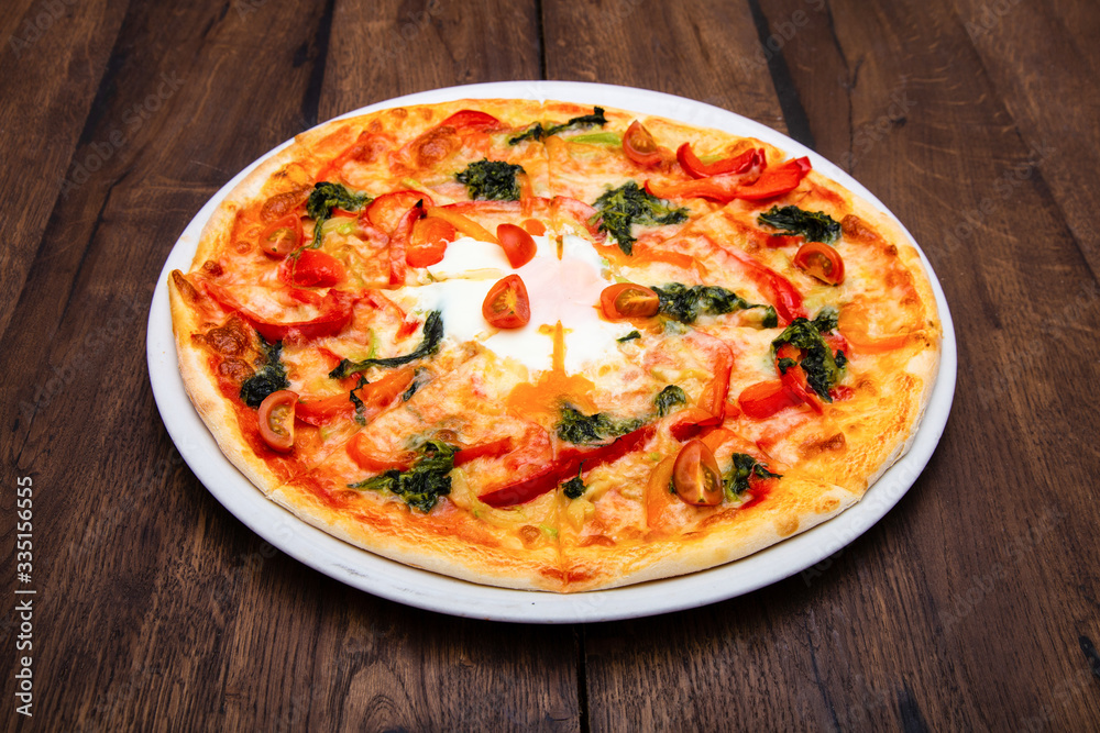 Classic Italian pizza on a wooden table