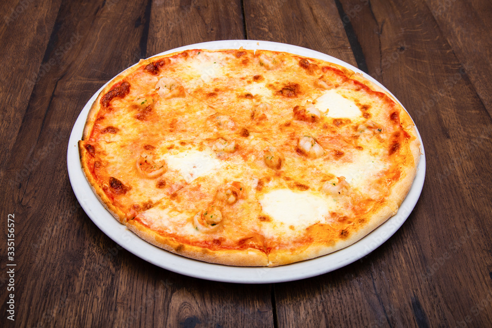 Classic Italian pizza on a wooden table