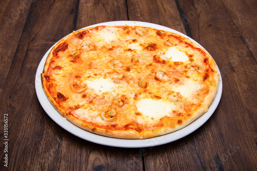 Classic Italian pizza on a wooden table