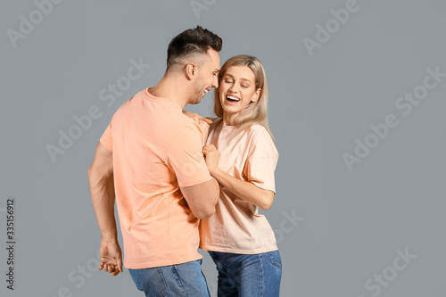 Happy young couple laughing...