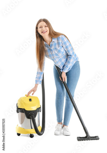 Young woman with vacuum cle...
