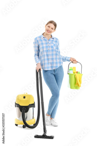 Young woman with vacuum cle...