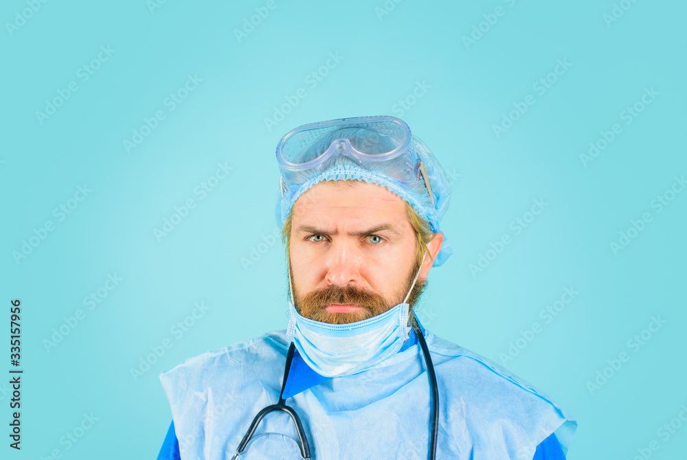 Doctor in protective mask. Healthcare and medicine concept. Hospital worker. Portrait of serious doctor. Doctor in hospital. Doctor in medical mask, cap and protective glasses. Coronavirus. Covid-19. Doctor in protective mask. Healthcare and medicine concept. Hospital worker. Portrait of serious doctor. Doctor in hospital. Doctor in medical mask, cap and protective glasses. Coronavirus. Covid-19.