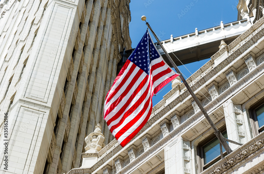 Close up United states flag outside building in Chicago, USA