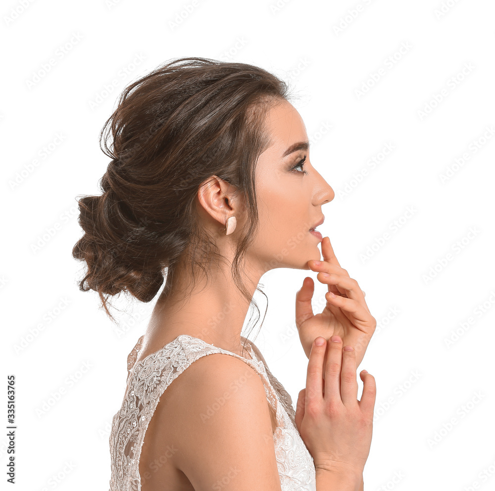 Young bride with beautiful hairdo on white background Young bride with beautiful hairdo on white background