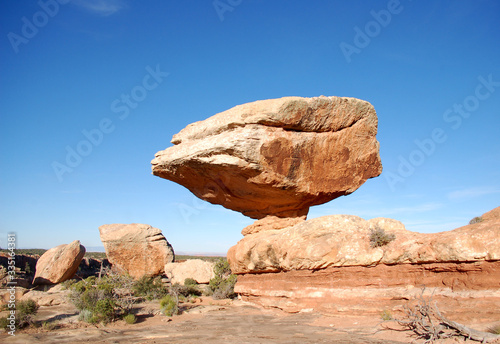 Massive balanced boulder in canyon country in the Bears Ears wilderness of Southern Utah.