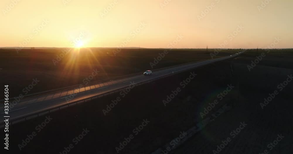 Highway road on sunset, cop car, police patrols the roads Highway road on sunset, cop car, police patrols the roads
