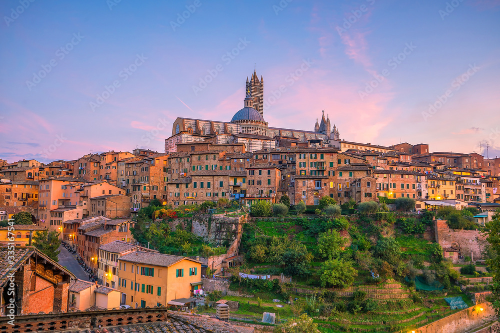 Downtown Siena skyline in Italy at sunset