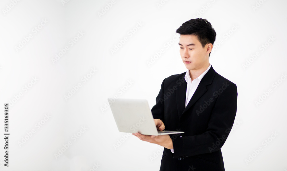 young businessman with laptop against white background young businessman with laptop against white background