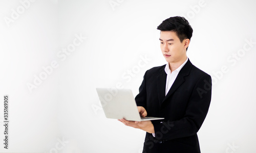young businessman with laptop against white background