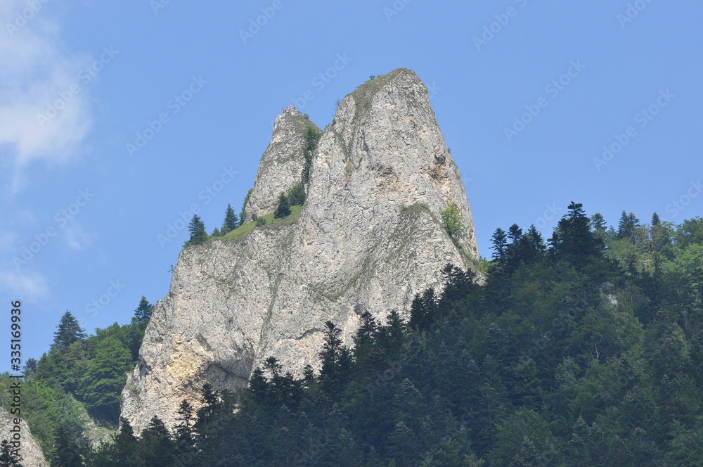 Bald mountain tops, Three Crowns in the Pieniny National Park in Poland. View from the Dunajec riverbed during rafting with rafts.rafting with rafts.