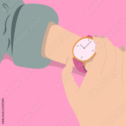A woman looking at a wristwatch.
