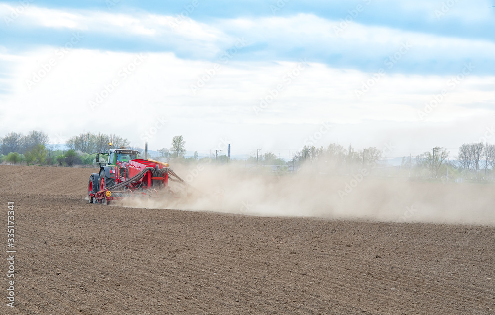 Fototapeta premium farmer seeding