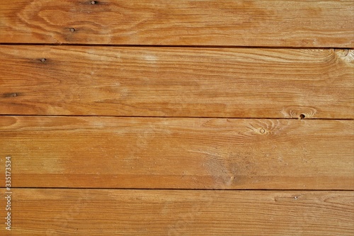 texture of wood planks coated with glaze. color similar to chestnut, teak, walnut or oak. May be suitable for advertising protective wood coatings