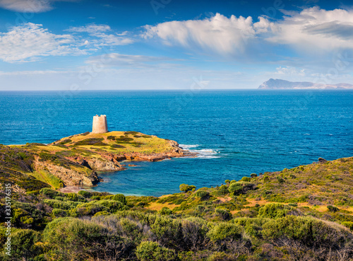 Marvelous summer view of Piscinni bay with Torre di Pixinni tower on background. Picturesque morning scene of Sardinia island, Italy, Europe. Mediterranean seascape. 