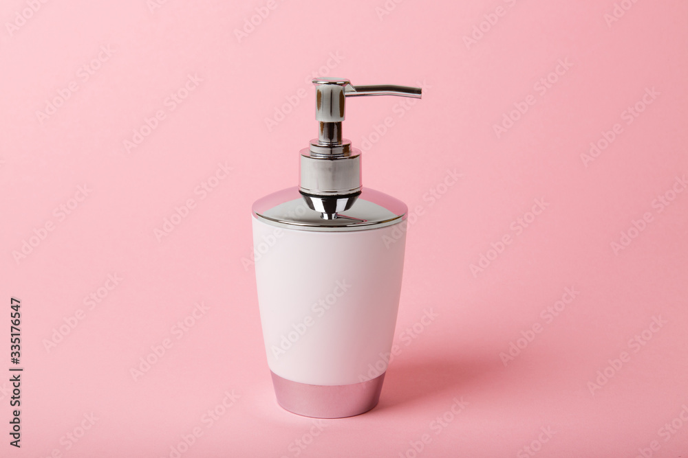 Liquid soap and sanitizer for hands on pink background. Stay home and stay safe. Self care and antivirus security. Hand disinfection. Measures to avoid infection. Quarantine and everyday home hygiene Liquid soap and sanitizer for hands on pink background. Stay home and stay safe. Self care and antivirus security. Hand disinfection. Measures to avoid infection. Quarantine and everyday home hygiene