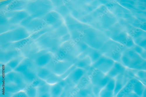 Blue water ripple reflection in the swimming pool © pandaclub23