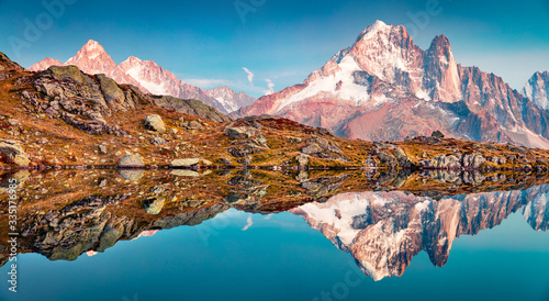 Calm autumn view of Cheserys lake with Mount Blank on background, Chamonix location. Fantastic evening scene of Vallon de Berard Nature Preserve, Alps, France, Europe.