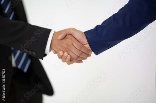 businessmen handshake after good deal