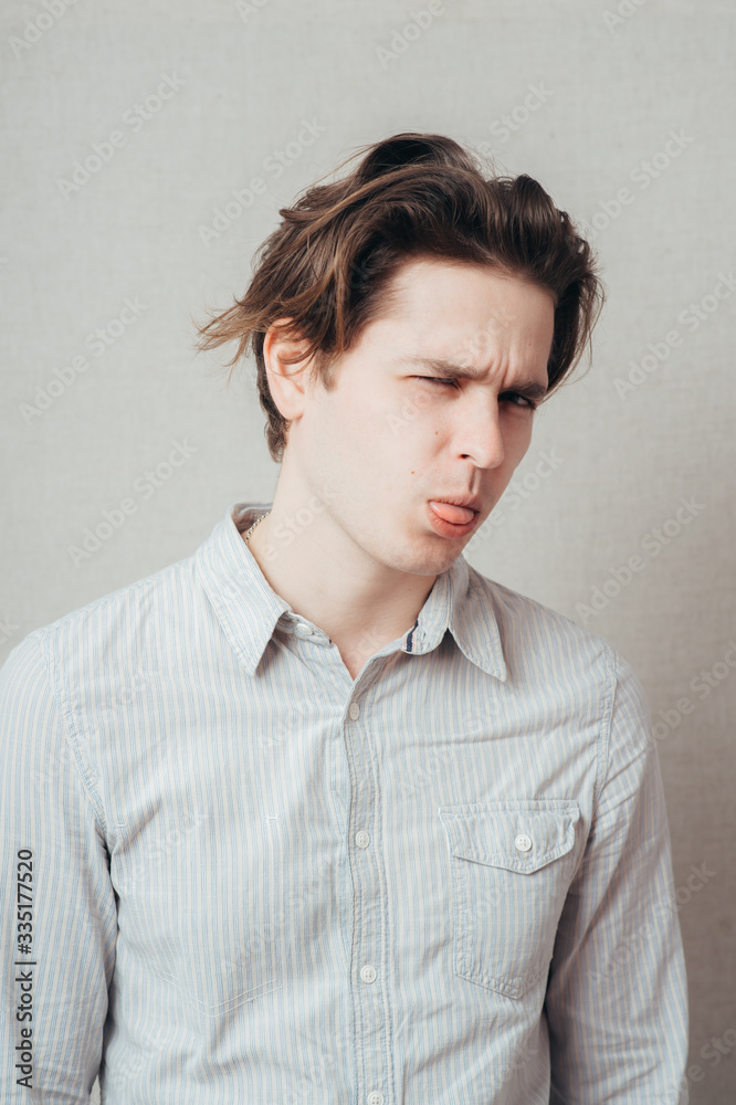 Adult man with bad manners - showing his tongue Adult man with bad manners - showing his tongue