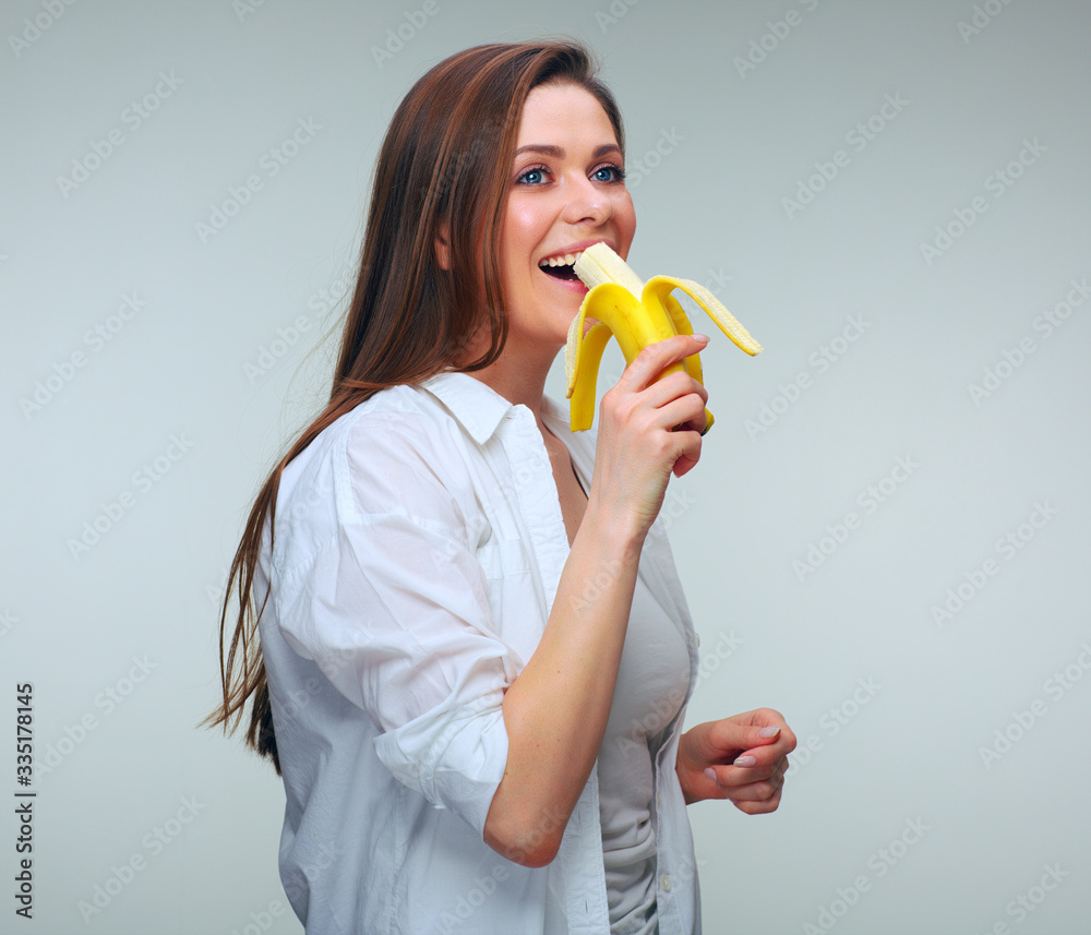 Happy woman eating banana. isolated female portrait. Happy woman eating banana. isolated female portrait.