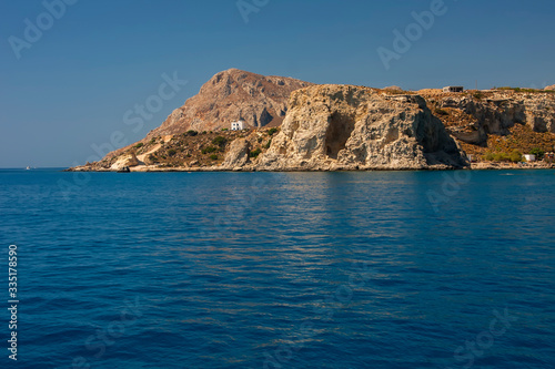 Beautiful stone mountain on the shore of the blue sea