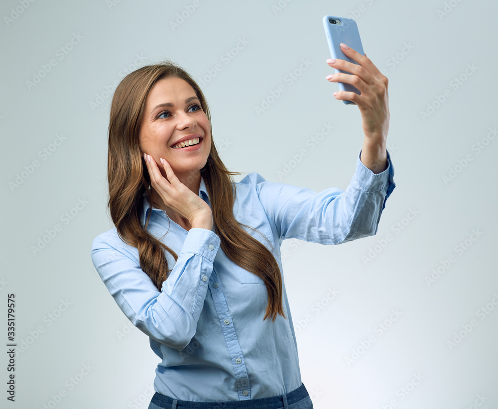 woman using smartphone for selfie photo. woman using smartphone for selfie photo.