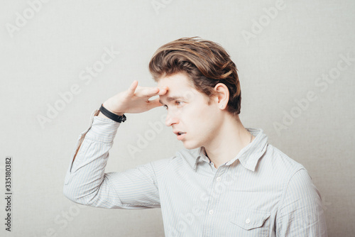 Young man with his hand in the forehead