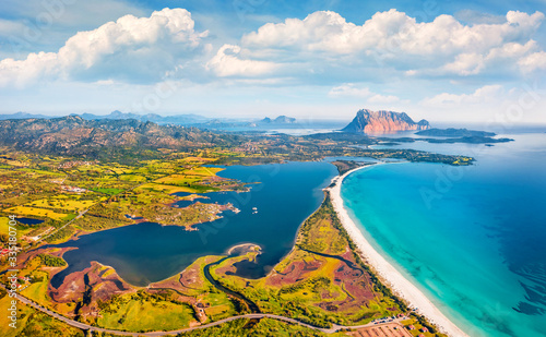 View from flying drone. Incredible spring view of La Cinta beach. Aerial morning scene of Sardinia island, Italy, Europe. Sunny Mediterranean seascape. Beauty of nature concept background.