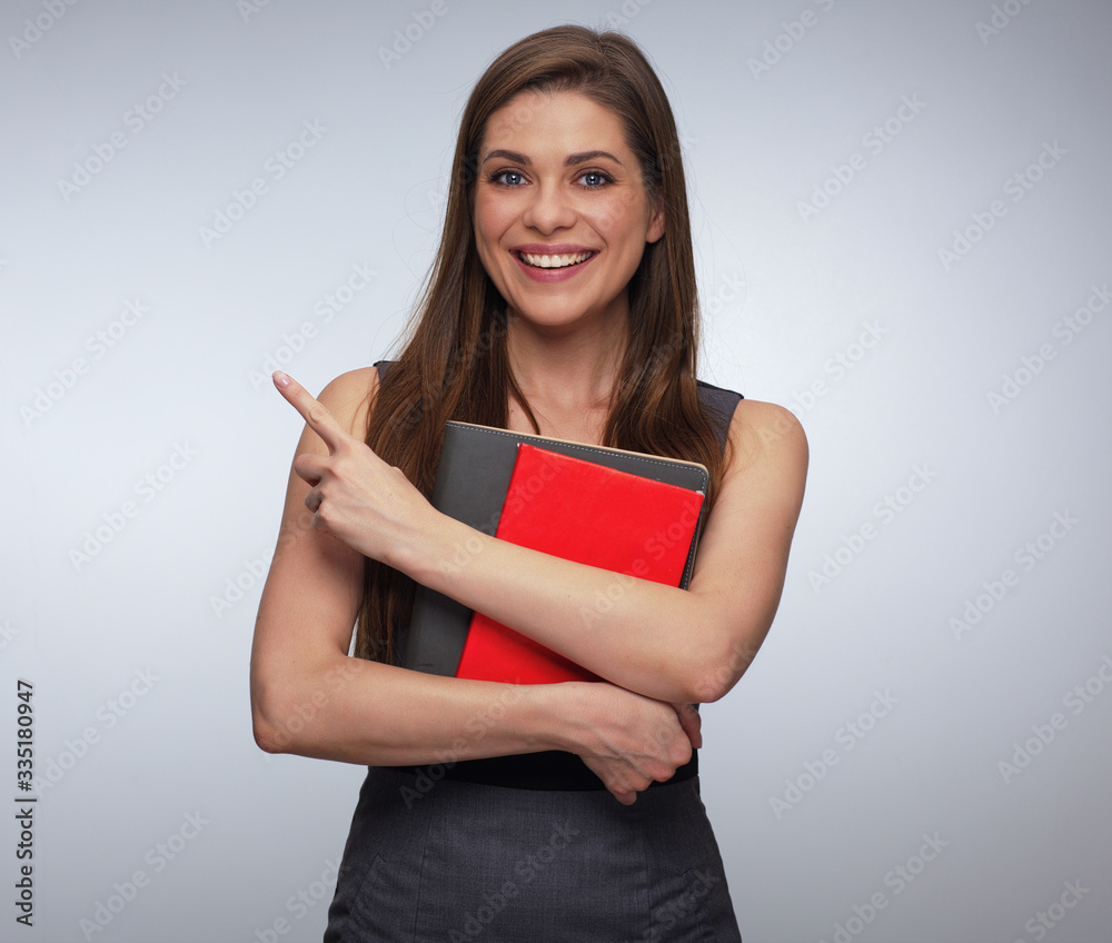Smiling teacher woman pointing with finger. Smiling teacher woman pointing with finger.