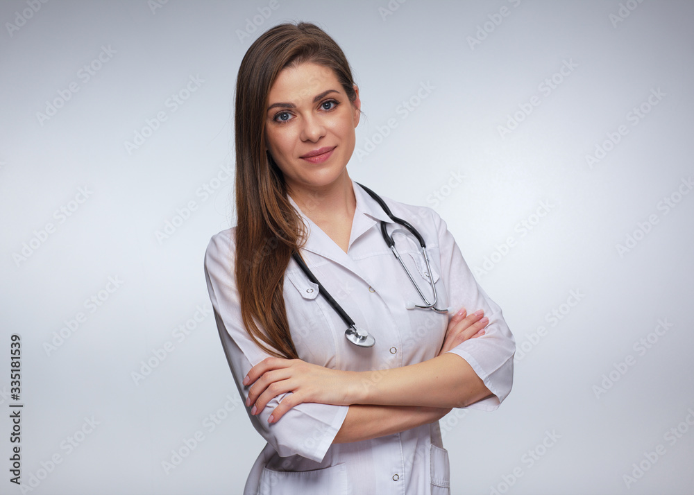 Smiling woman doctor with stethoscope standing with crossed arms. Smiling woman doctor with stethoscope standing with crossed arms.