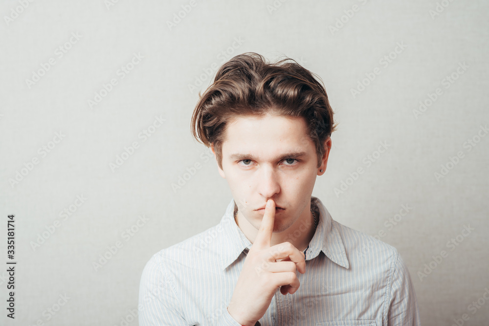 man put his finger to his lips man put his finger to his lips