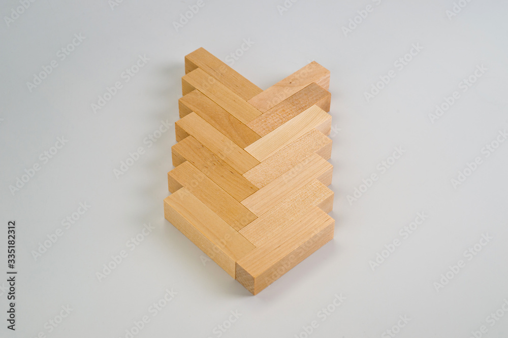 A puzzle game made of wooden blocks. Background for the development of imagination and spatial thinking. A puzzle game made of wooden blocks. Background for the development of imagination and spatial thinking.