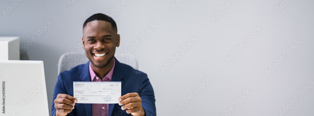 Businessman Holding Cheque Businessman Holding Cheque