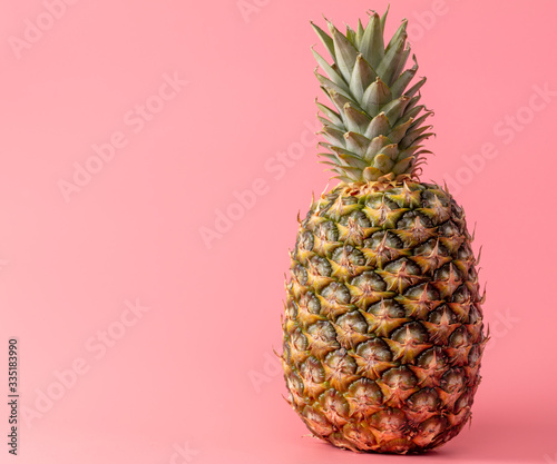 Pineapple isolated on a pink background.