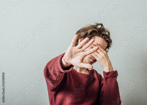 Businessman shows stop gesture