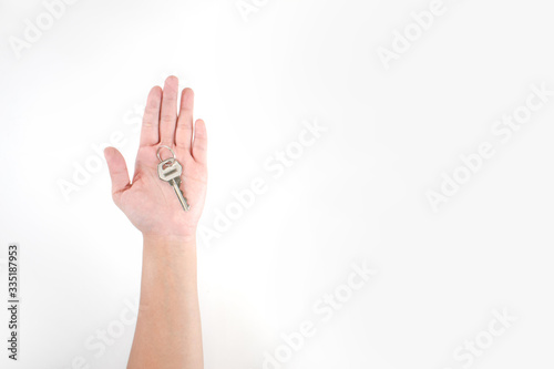 The image in the hands of Asian people has keys on a white background.