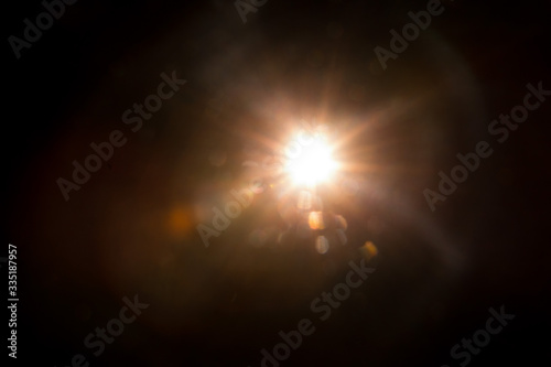 Fototapeta Naklejka Na Ścianę i Meble -  Abstract Natural Sun flare on the black background.