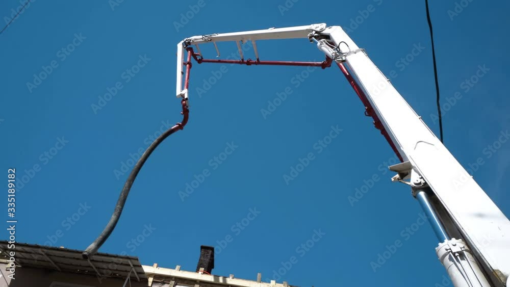 Concrete Pump Crane Arm against Blue Sky Concrete Pump Crane Arm against Blue Sky
