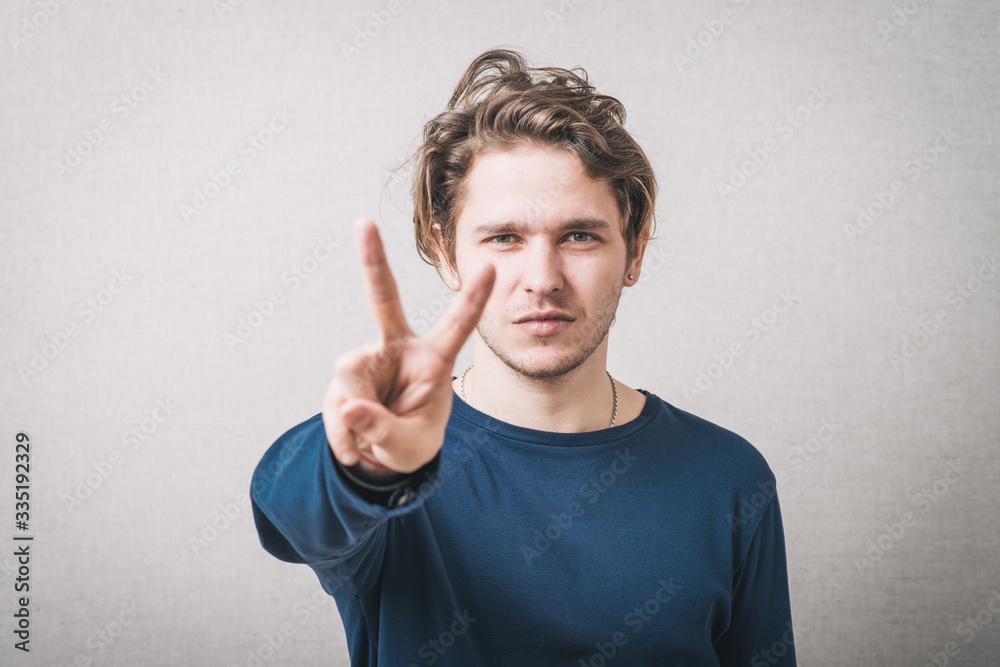 man showing two fingers man showing two fingers
