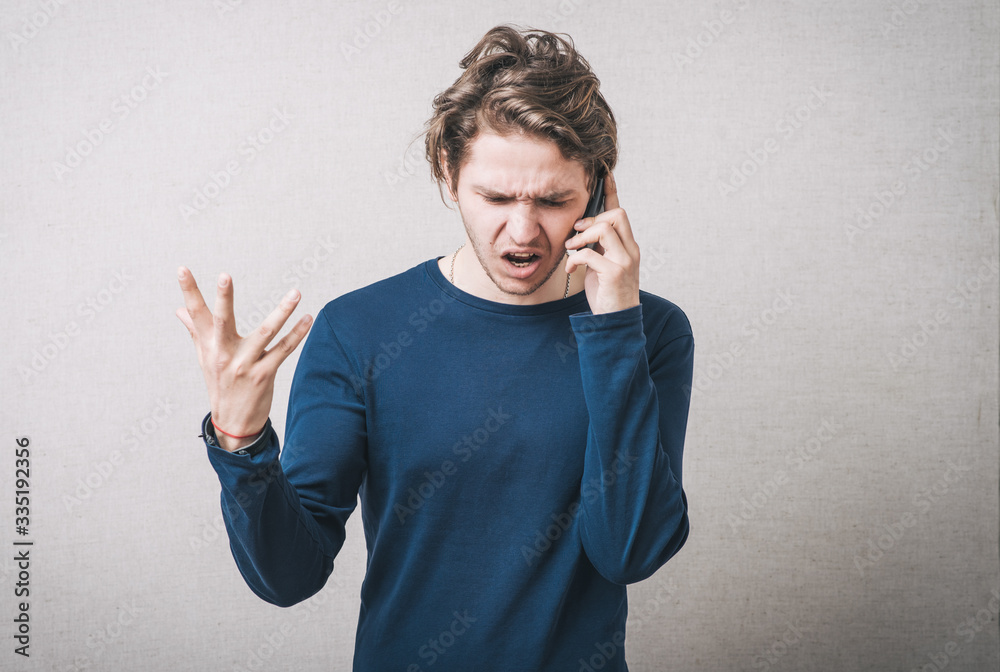 Angry business man screaming on cell mobile phone, conversation Angry business man screaming on cell mobile phone, conversation