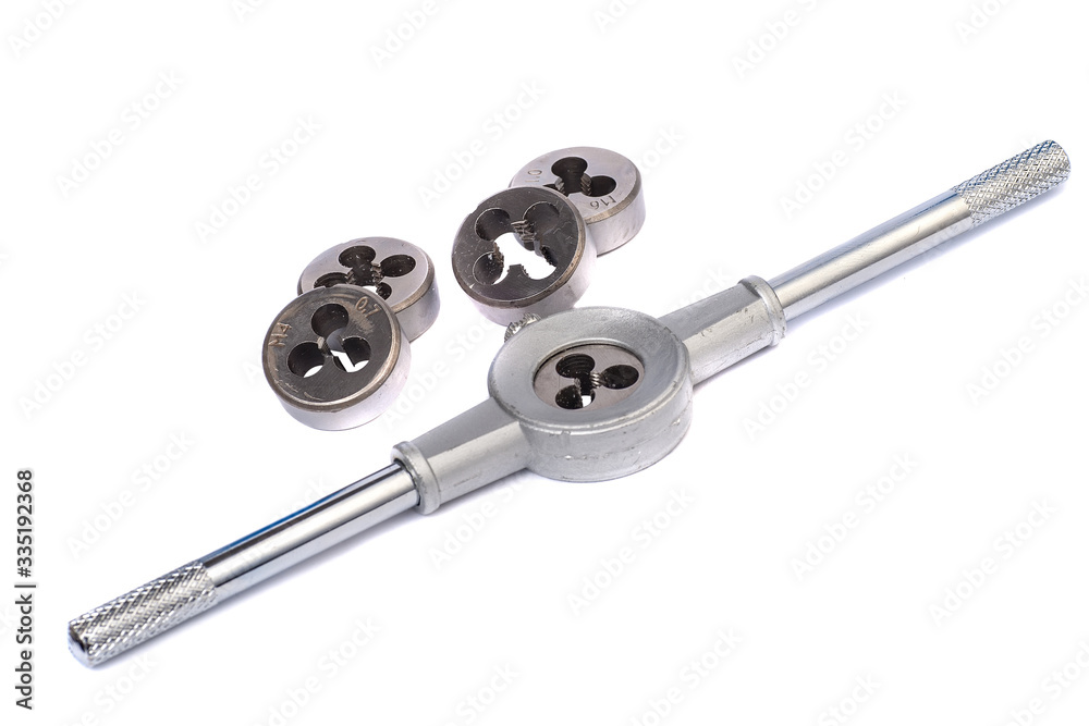 Hand tool for cutting threads with interchangeable dies isolated on a white background Hand tool for cutting threads with interchangeable dies isolated on a white background