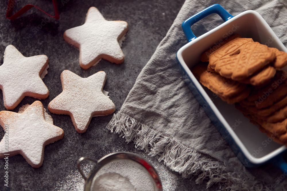 Freshly Baked Star Shaped Christmas Cookies On Board Dusted With Icing Sugar