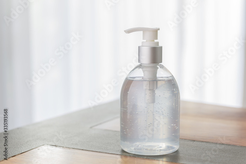 Wallpaper Mural Hand sanitizer bottle or alcohol gel on white wood background for Coronavirus disease (COVID-19) prevention. Torontodigital.ca