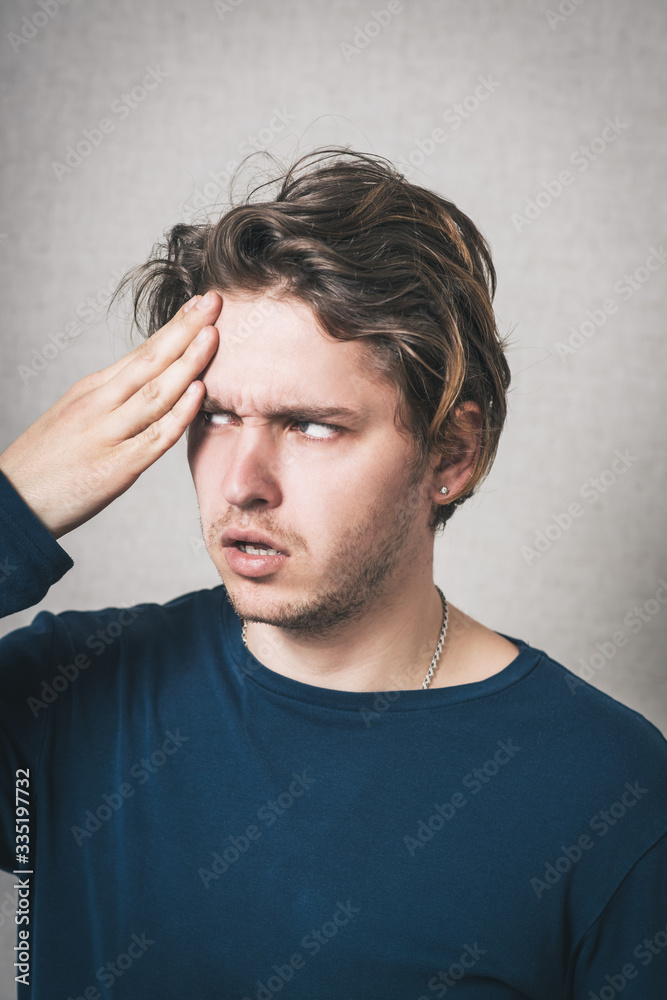 Man headache. Gray background Man headache. Gray background
