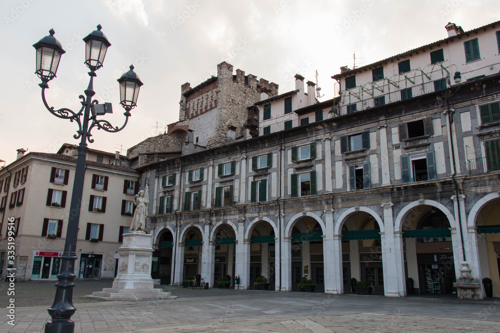 Fototapeta premium Arcades and clock tower in Piazza della Loggia, Brescia, Lombardy, Italy.