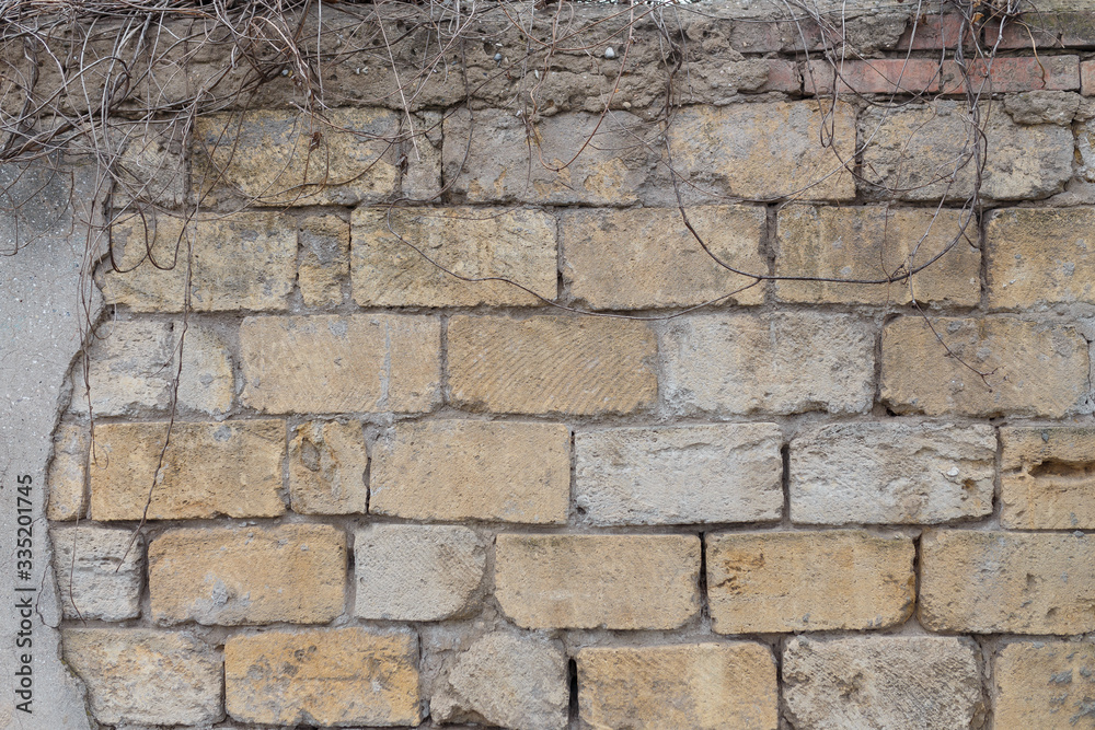 Fototapeta premium Dirty uneven brickwall texture background or backdrop with stains and cement smears