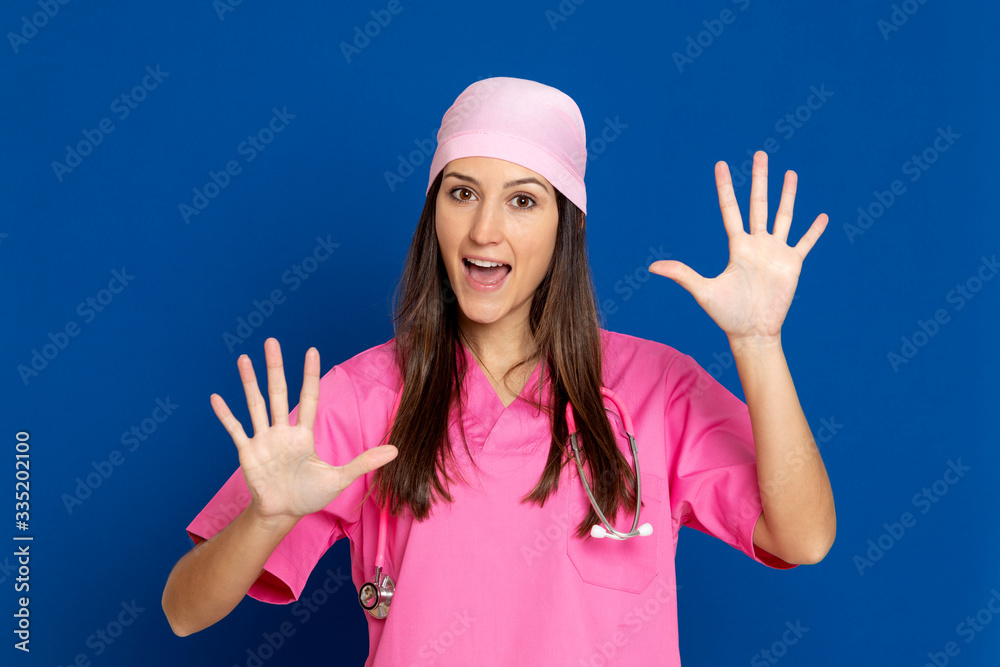 Young doctor with a pink uniform Young doctor with a pink uniform