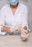 Woman in quarantine for Coronavirus wearing protective mask and gloves.